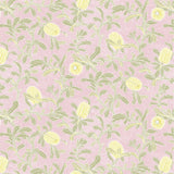 Detail of wallpaper in a floral print in shades of yellow and green on a light pink field.