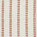 Detail of fabric in a playful ticking stripe print in rust on a white field.