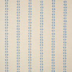 Detail of fabric in a playful ticking stripe print in light blue on a tan field.