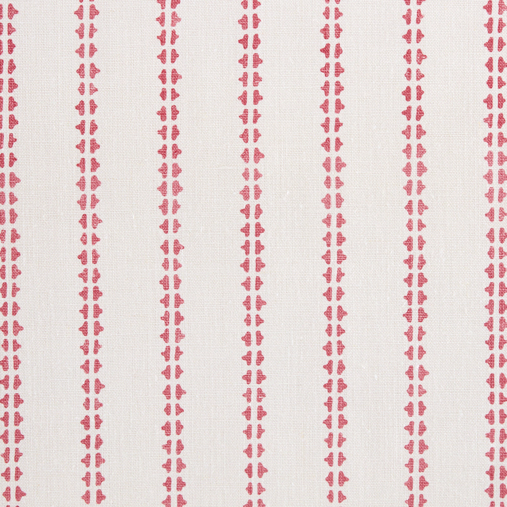 Detail of fabric in a playful ticking stripe print in pink on a white field.