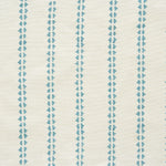 Detail of fabric in a playful ticking stripe print in turquoise on a cream field.