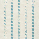 Detail of fabric in a playful ticking stripe print in turquoise on a cream field.