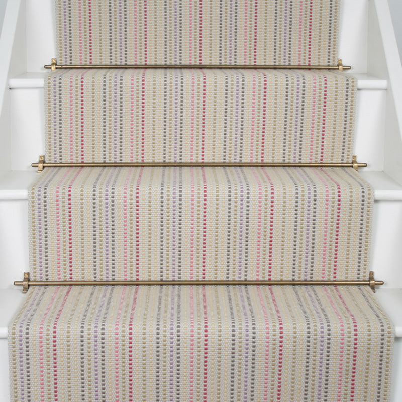 Striped flatweave runner in cream and blue green and pink on white staircase