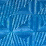 Detail of a leather wall tile in an angular geometric pattern in blue and white.