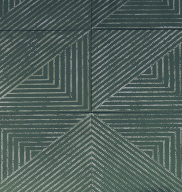 Detail of leather wall tiles in an angular geometric pattern in teal and off white.