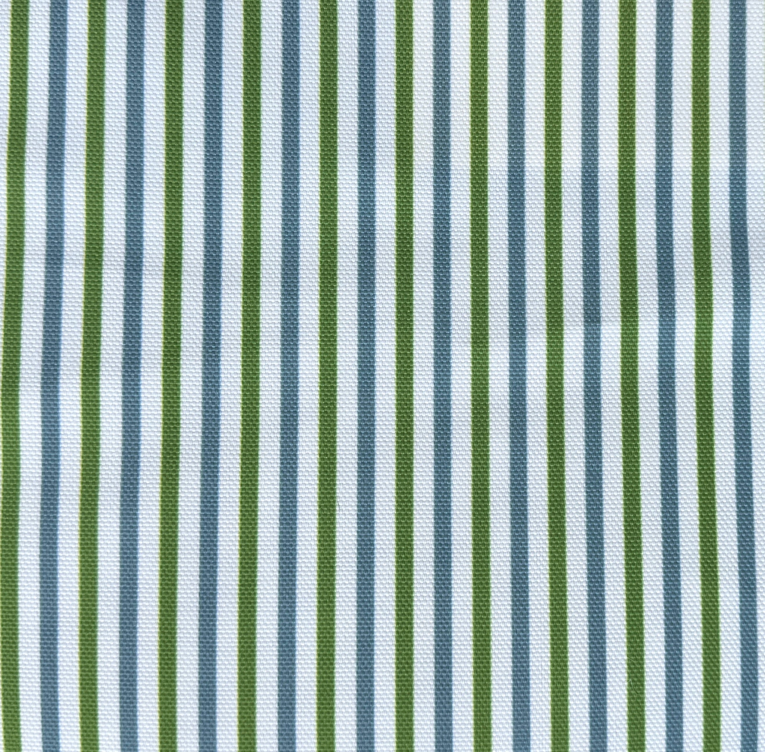 Detail of fabric in a small-scale stripe print in green and blue on a white field.