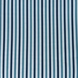 Detail of fabric in a small-scale stripe print in blue and navy on a light blue field.