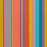 Detail of outdoor fabric in an irregular rainbow stripe print.