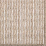 Close-up of a textured beige carpet with a subtle pattern