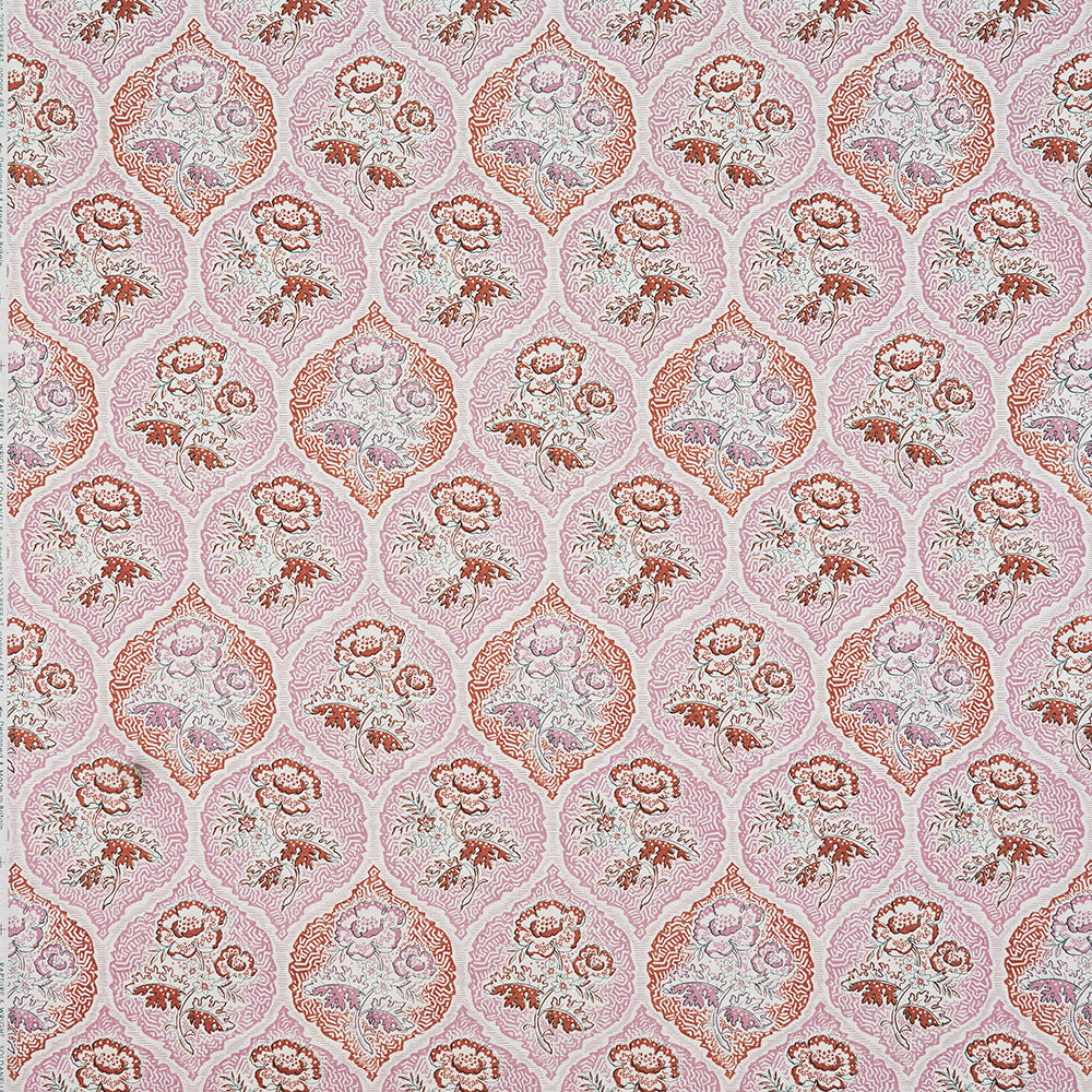 Detail of fabric in a floral damask print in shades of pink and red on a cream field.