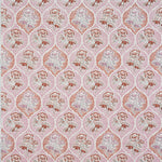 Detail of fabric in a floral damask print in shades of pink and red on a cream field.