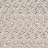 Detail of fabric in a floral damask print in shades of gray and mustard on a cream field.