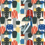 Detail of wallpaper in a playful soldier print in a rainbow of colors on a white field.