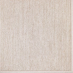 Broadloom carpet in a textural weave in beige. 
