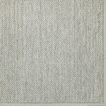Broadloom carpet in a textural weave in sage green.