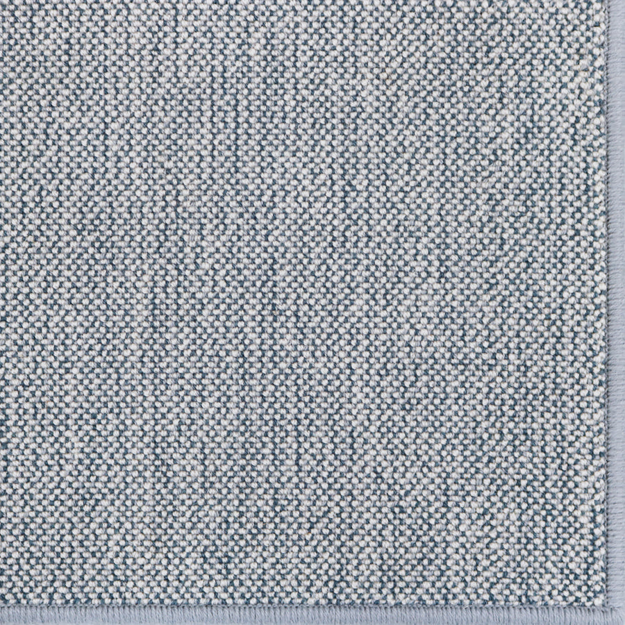 Broadloom carpet in a textural weave in slate blue.