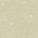 Detail of fabric in a playful bird and leaf print in cream on a light green field.