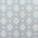 Detail of fabric in a floral damask print in white on a light gray field.