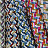 An array of woven stair step patterned fabrics.