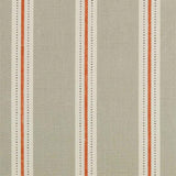 Detail of fabric in a repeating stripe print in cream and burnt orange on a tan field.