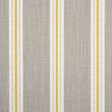 Detail of fabric in a repeating stripe print in white and yellow on a light gray field.