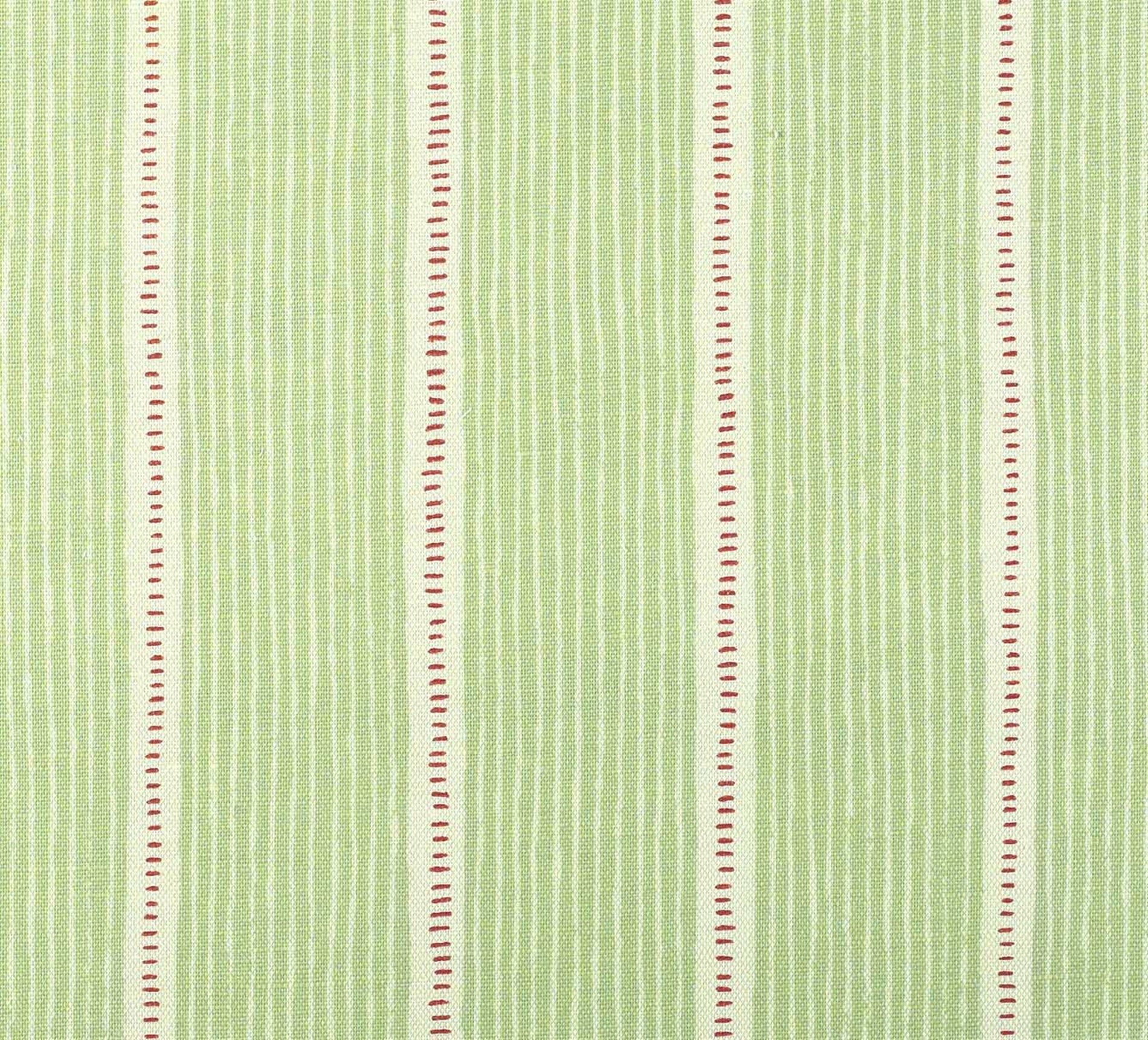 Detail of fabric in a repeating stripe and dash pattern in green and pink on a cream field.