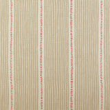 Detail of fabric in a repeating stripe and dash pattern in tan and red on a cream field.