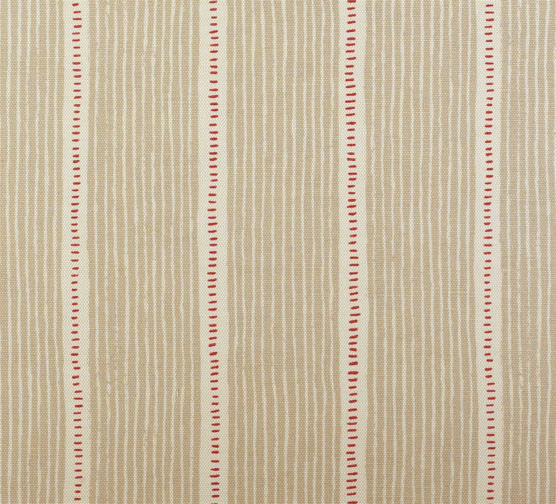 Detail of fabric in a repeating stripe and dash pattern in tan and red on a cream field.