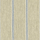 Detail of fabric in a repeating stripe and dash pattern in tan and blue on a cream field.