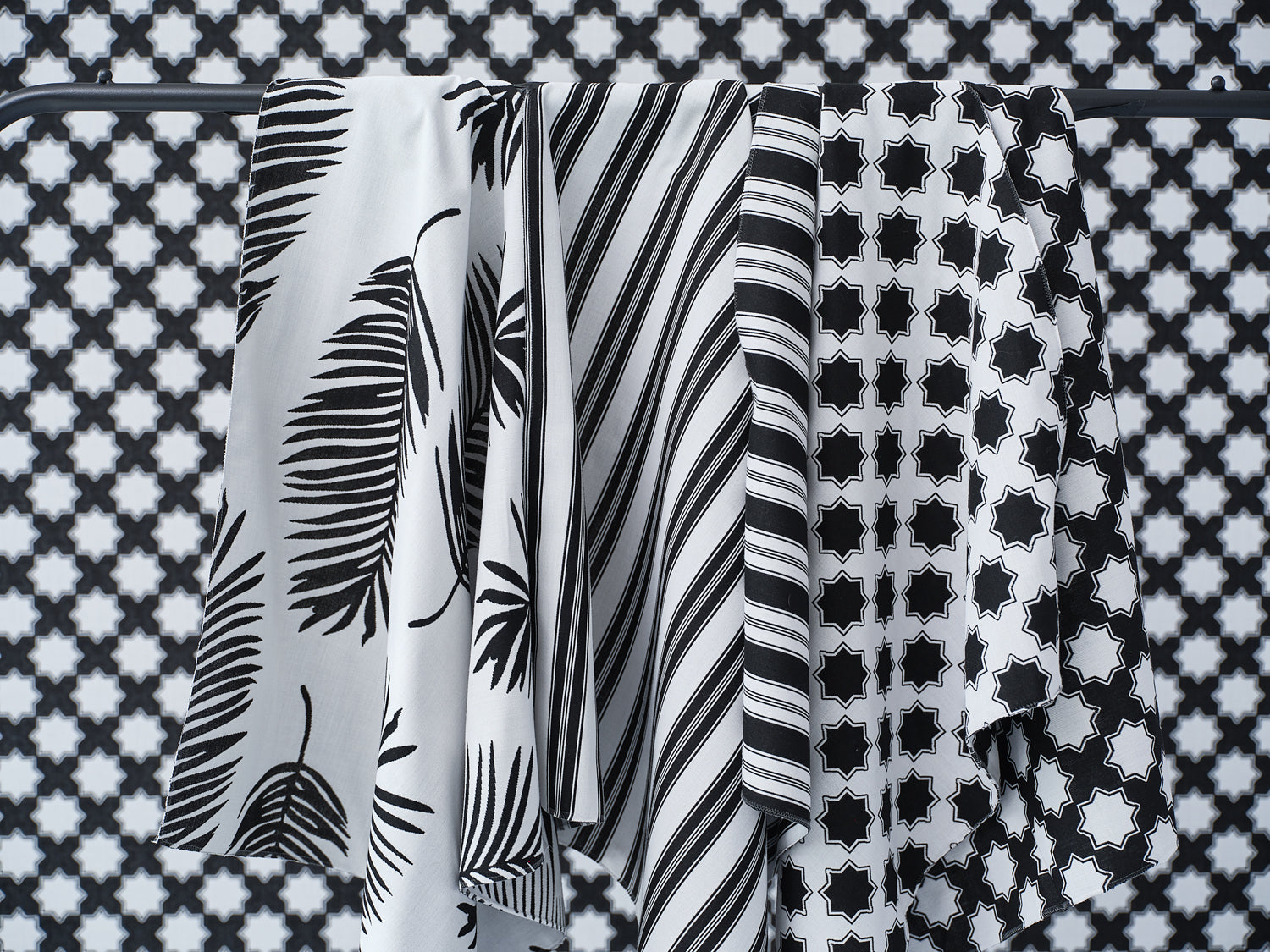 Performance fabrics in black and white in 
a palm print, moroccan star and simple stripe.