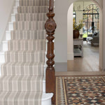 Striped flatweave runner in grey and black on white staircase