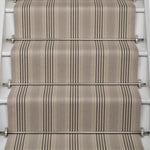 Striped flatweave runner in grey and black on white staircase