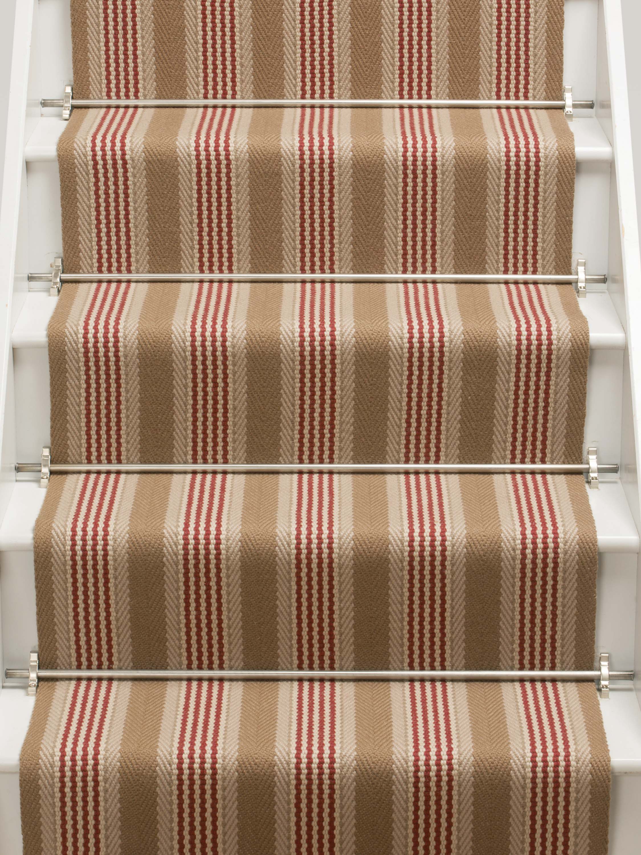 Striped flatweave runner in tan and red on white staircase