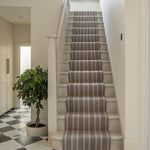 Striped flatweave runner in grey and black on white staircase