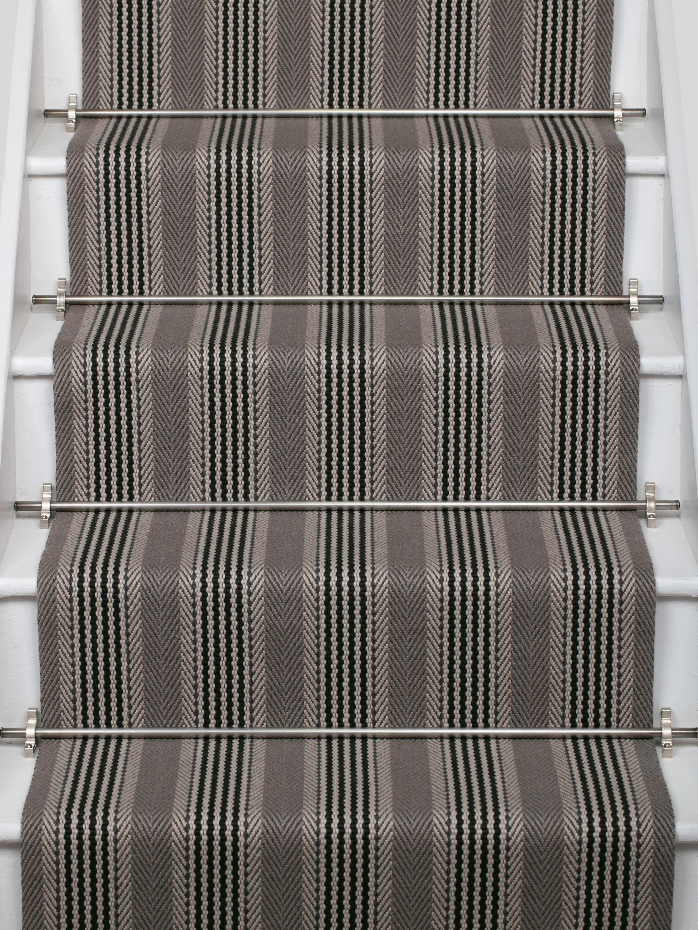 Striped flatweave runner in grey and black on white staircase