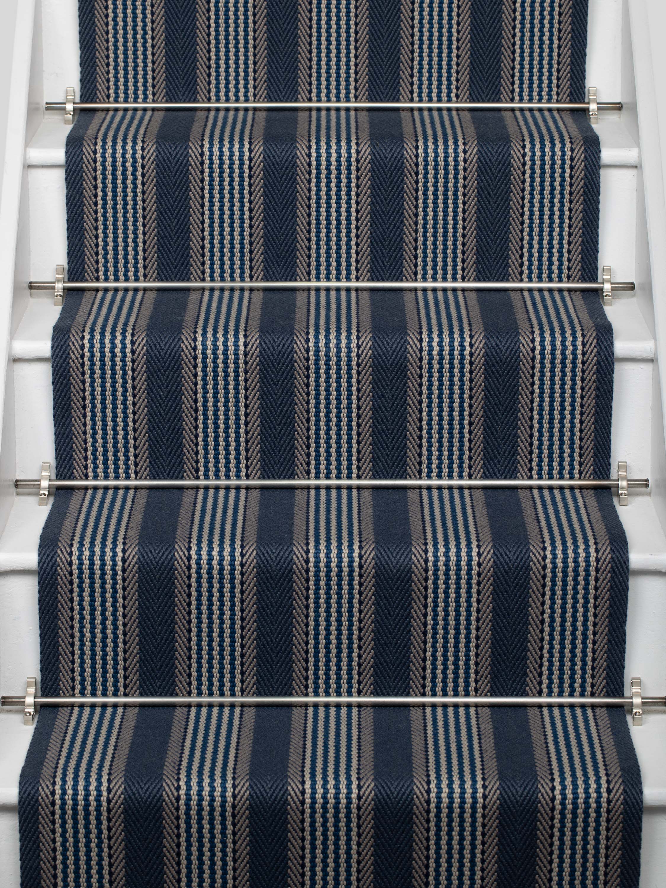 Striped flatweave runner in blue on white staircase