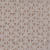 Detail of fabric in a star-shaped lattice print in tan and gray on a cream field.