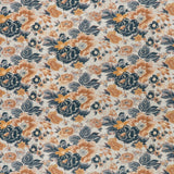 printed linen fabric in a detailed floral pattern in shades of blue and orange on a cream field.