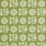 Detail of fabric in a repeating sunflower print in white on an olive field.