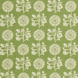 Detail of fabric in a repeating sunflower print in white on an olive field.