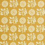 Detail of fabric in a repeating sunflower print in white on a mustard field.