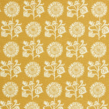 Detail of fabric in a repeating sunflower print in white on a mustard field.