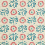 Detail of fabric in a repeating sunflower print in coral and blue on a cream field.