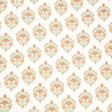 Detail of fabric in a floral paisley print in shades of green and coral on a white field.