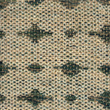 Close-up of a woven rug  with a diamond pattern in shades of green.