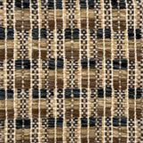 Close-up of a woven rug  with a geometric checker pattern in tan, brown  and blue.