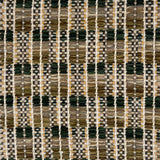 Close-up of a woven rug  with a geometric checker pattern in earthy tones.