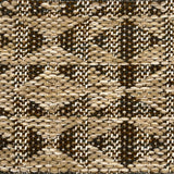 Close-up of a woven rug with geometric pattern in shades of tan and brown.
