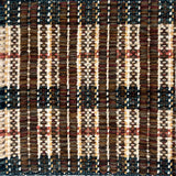 Close-up of a woven rug  with a plaid pattern in brown, beige, and teal.