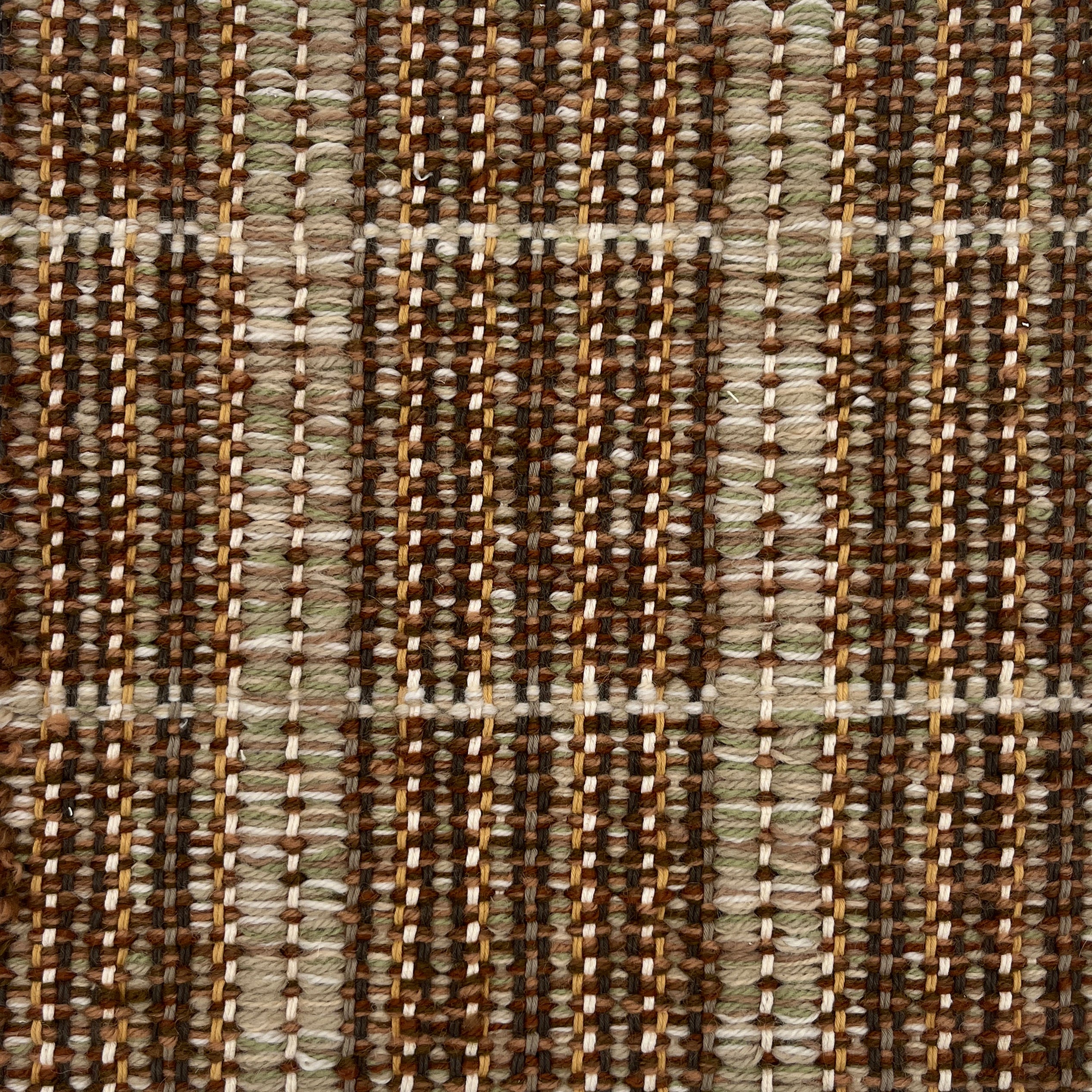 Close-up of a textured brown and beige plaid woven rug. 